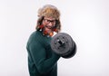 Man with decorated beard working on his biceps with dumbell