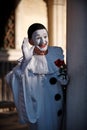 Venice Italy, February 18 2020. Man in decorated mask posing to photographers and salute crowd at St Mark`s Square during Venice C