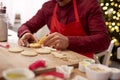 Man decorating cookies in the kitchen Royalty Free Stock Photo