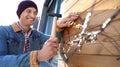 Man decorating house with Christmas lights Royalty Free Stock Photo