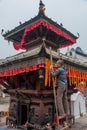 Man decorating the roof of the temple building