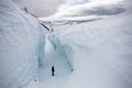 Man in the deep glacier crevasse - Arctic