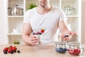 Man with delicious yogurt with fresh berries Royalty Free Stock Photo