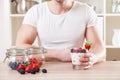 Man with delicious yogurt with fresh berries Royalty Free Stock Photo