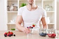 Man with delicious yogurt with fresh berries Royalty Free Stock Photo