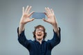 Man delighted by his transparent high-tech smartphone Royalty Free Stock Photo