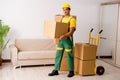 The man delivering boxes during house move Royalty Free Stock Photo