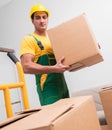 Man delivering boxes during house move Royalty Free Stock Photo