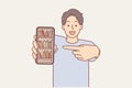 Man demonstrates online library with books on phone and points finger at display