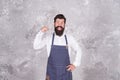 Man denim apron stylish barbershop staff bearded hipster, motivated worker concept