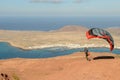 Man during departure with his parapent at Mirador del Rio on Lanzarote island in Spain