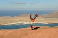 Man during departure with his parapent at Mirador del Rio on Lanzarote island in Spain