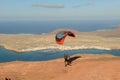 Man during departure with his parapent at Mirador del Rio on Lanzarote island in Spain