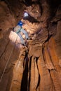 Man descending into cave