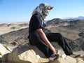 Man in desert with keffiyeh Royalty Free Stock Photo