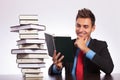 Man at desk reading book Royalty Free Stock Photo