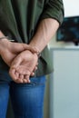 Man detained in handcuffs indoors,  view. Criminal law Royalty Free Stock Photo