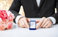 Man with diamond engagement ring in blue gift box Royalty Free Stock Photo