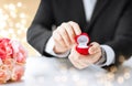 Man with diamond engagement ring in red gift box Royalty Free Stock Photo