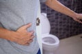 A man with diarrhea. Sick man suffering from diarrhea,abdominal pain or Food poisoning, gastritis. Diarrhea,