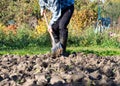 Man digging the garden soil with spade, detail Royalty Free Stock Photo