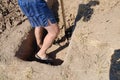 Man digs a deep grave. gravedigger digs a grave with a shovel in a cemetery Royalty Free Stock Photo