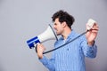 Man directing megaphone at herself Royalty Free Stock Photo