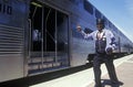 A man directing traffic at Caltrain, Cupertino, California