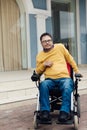 a man with disabilities in a wheelchair enjoys life Royalty Free Stock Photo