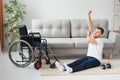 Man Disabled. Sports for Disabled. Male in Wheelchair with Dumbbells in Hands. Man with Dumbbells in Hands. Father Disabled Do Royalty Free Stock Photo