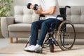 Man Disabled. Sports for Disabled. Male in Wheelchair with Dumbbells in Hands. Man with Dumbbells in Hands. Father Disabled Do Royalty Free Stock Photo