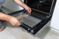 Cleaning a dirty oven in the kitchen Royalty Free Stock Photo