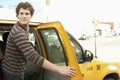 Man Disembarking Taxi While Looking Away Royalty Free Stock Photo