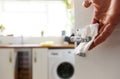 Man disinfects door handle with wipe. Royalty Free Stock Photo