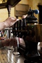 Man dispensing drought beer from generator