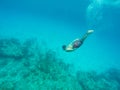 Man diving into the blue sea