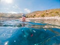 man in diving mask snorkeling in sea water