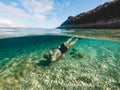 man in diving mask snorkeling in sea water