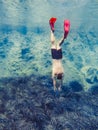 man in diving mask snorkeling in sea water