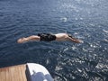 Man Diving Into Sea From Yacht Royalty Free Stock Photo