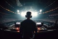 man DJ mixes on mixing board in booth at electronic live concert at night. Generative AI