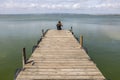 Man On A Dock By The Lake At morning Sky