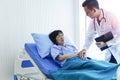 Man doctor checking pressure of female patient, Older sick woman patient lay on bed in hospital with intravenous normal saline