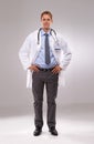 Man, doctor and confident in studio, portrait and medical professional on gray background. Male person, healthcare and