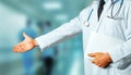 Man Doctor With Medical Card Holds Out His Hand To Say Hello. Greeting Patient. Healthcare Medicine Concept Royalty Free Stock Photo