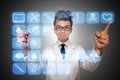 The man doctor pressing buttons with various medical icons Royalty Free Stock Photo