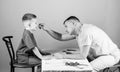 Man doctor sit table medical tools examining little boy patient. Health care. Pediatrician concept. Child care. Careful Royalty Free Stock Photo