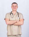 Man doctor with stethoscope physician uniform. Medicine and health care. Professional doctor. Experienced doctor beige