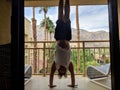 Man does Handstand on balcony