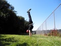 Man does Handstand in Golden Gate Park along fence